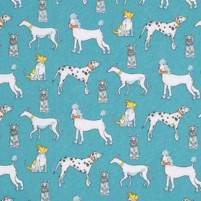 Poodles, dalmatians and terriers appear on this pet lovers polycotton fabric print on turquoise