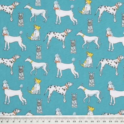 Poodles, dalmatians and terriers appear on this pet lovers polycotton fabric print on turquoise with a cm ruler