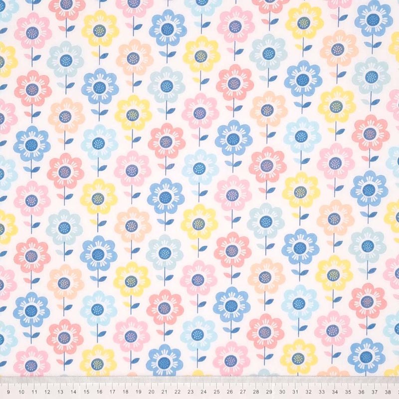 A retro pastel floral design printed on a white polycotton fabric with a cm ruler at the bottom