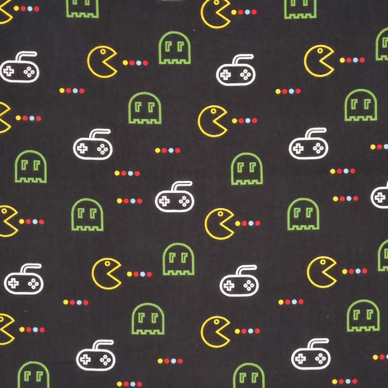 A video game design in green and yellow printed on a black polycotton fabric