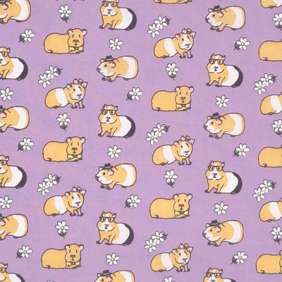 Guinea pigs sporting bow ties, glasses, hair bows and hats are printed on a quality lilac polycotton fabric
