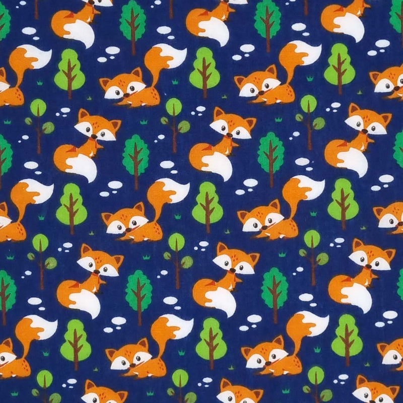 Curious foxes are printed on a navy polycotton fabric