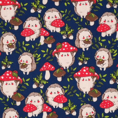 Cute hedgehogs and toadstools with ladybirds are printed on a navy polycotton fabric