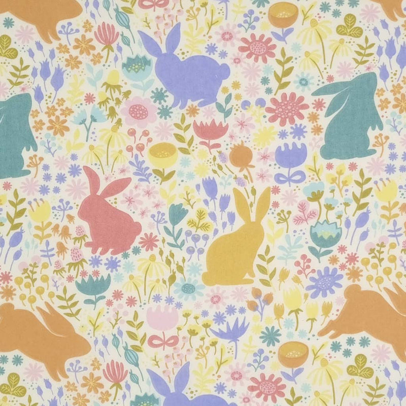 Easter bunnies printed on a cream polycotton fabric