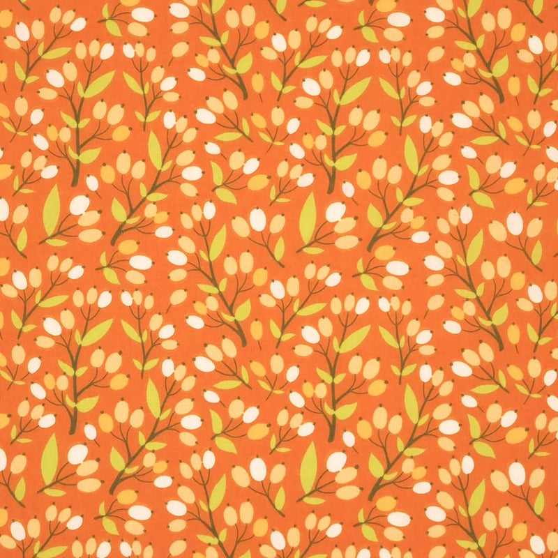 A floral design with berries printed on a rust coloured polycotton fabric