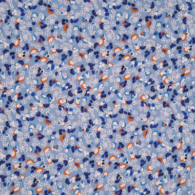 A ditsy floral printed on a blue viscose fabric