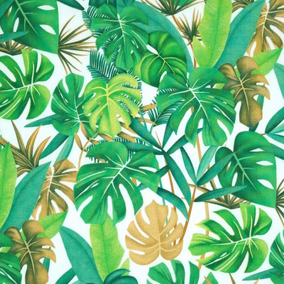 Tropical green leaves printed on a white cotton poplin by Rose & Hubble