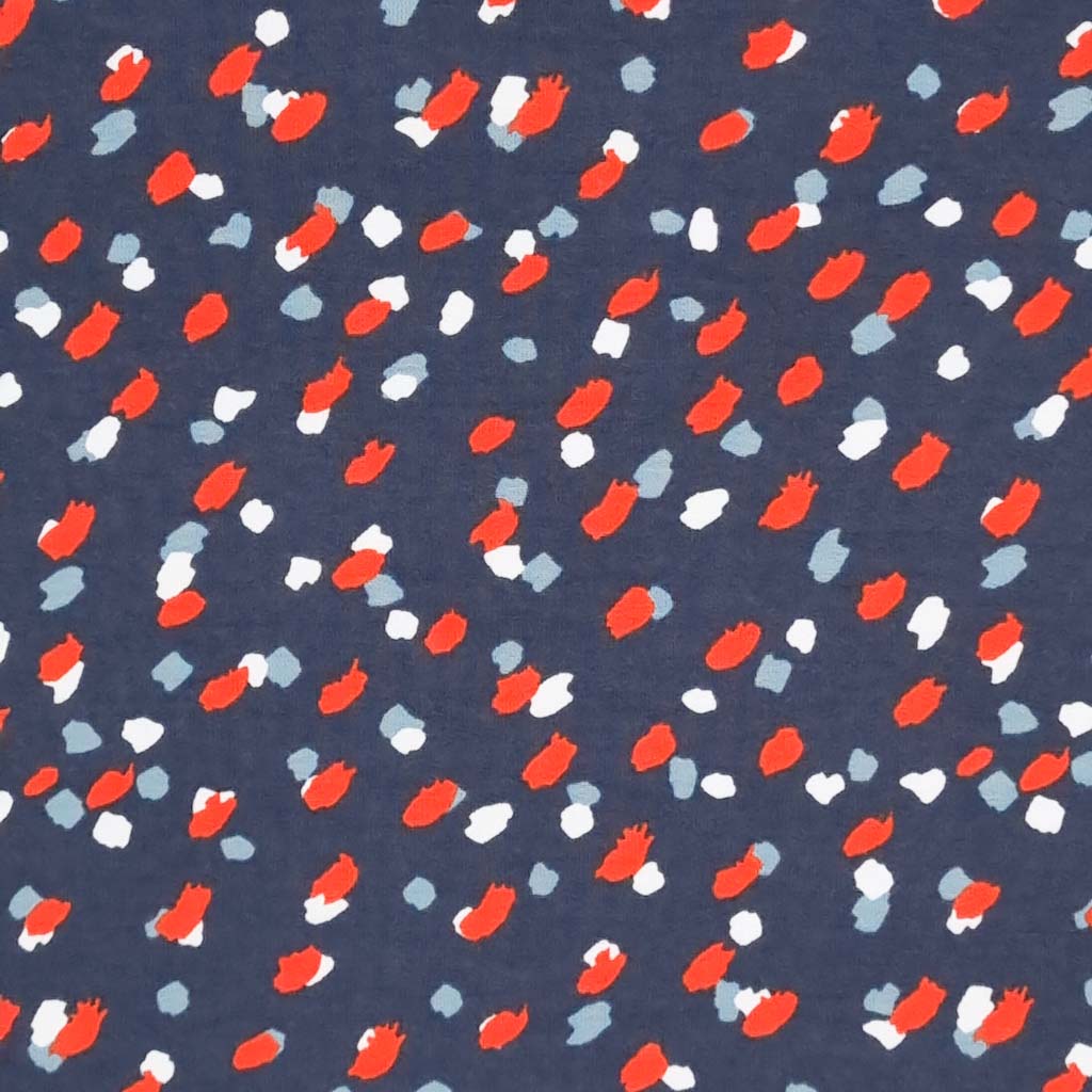 Sketchy spots are printed on a navy organic cotton french terry fabric