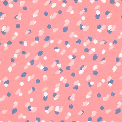 Sketchy spots printed on a rose pink organic french terry fabric