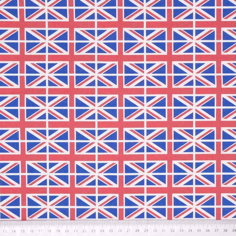 Small union jack flags are printed on a 100% cotton fabric with a cm ruler at the bottom