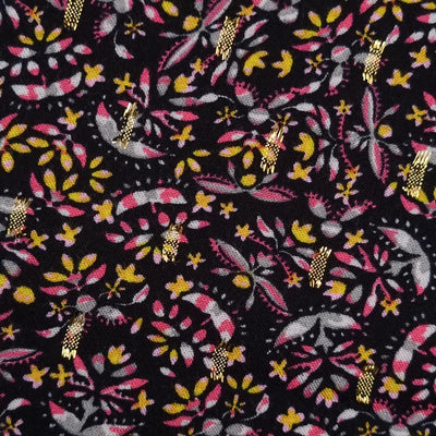 A close up image of golden lurex in viscose fabric