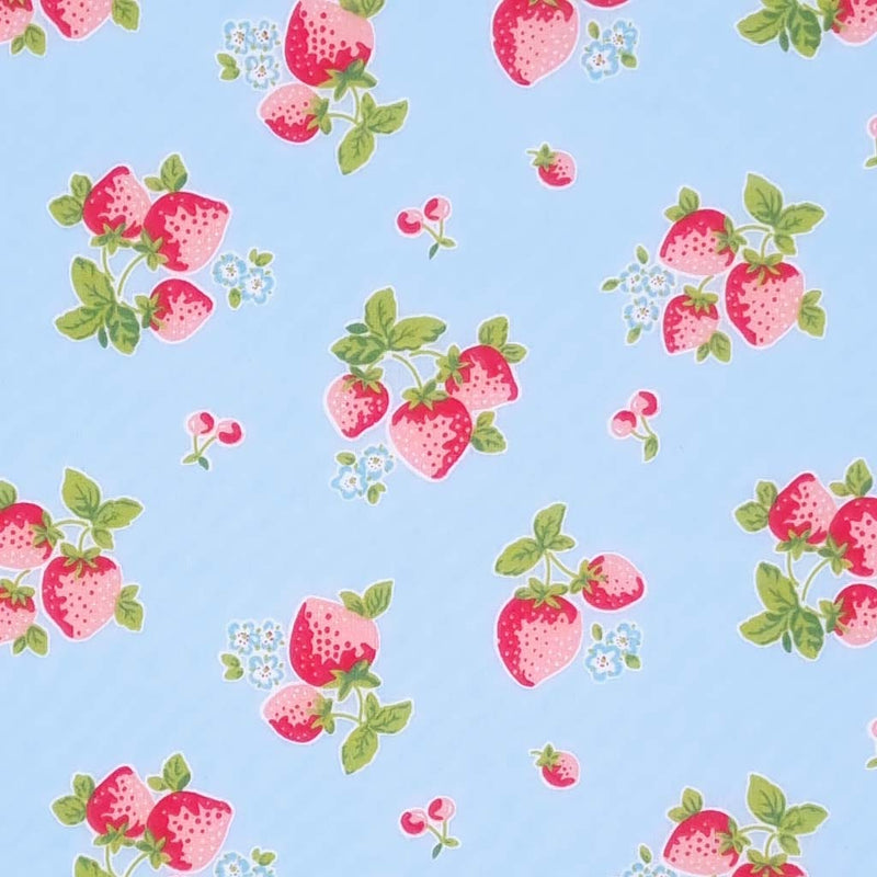 Red strawberries are printed on a sky blue polycotton fabric