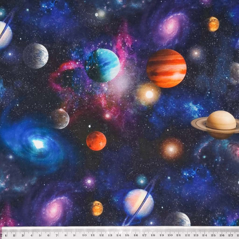 Planets, moons and black holes printed on a cotton fabric by Little Johnny with a cm ruler