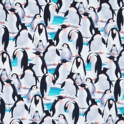 Watercolour painting of penguins printed on a single stretch cotton jersey fabric