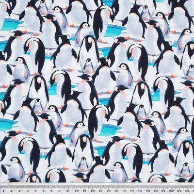 Watercolour painting of penguins printed on a single stretch cotton jersey fabric with a ruler at the bottom