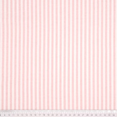 Pink and white candy stripes printed on a soft brushed polycotton winceyette with a cm ruler at the bottom