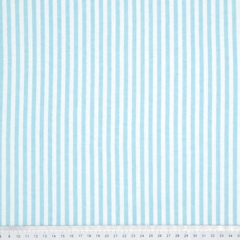 Baby blue and white candy stripes printed on a soft brushed polycotton winceyette with a cm ruler at the bottom