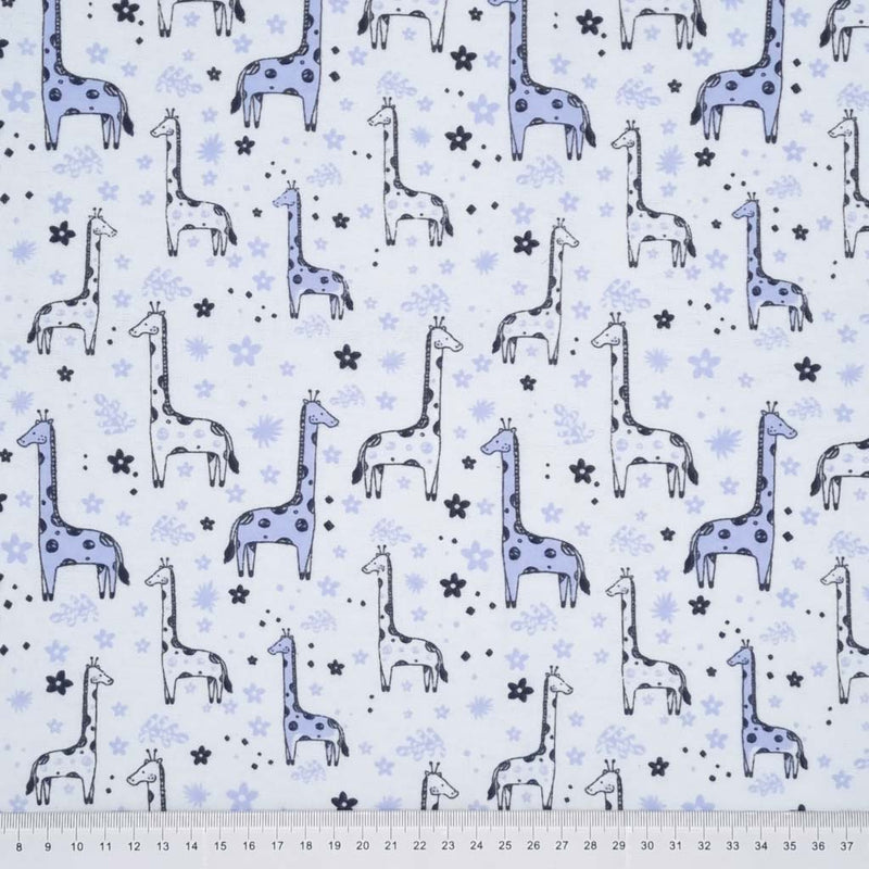 Blue giraffes are printed on a brushed cotton winceyette fabric with a cm ruler at the bottom