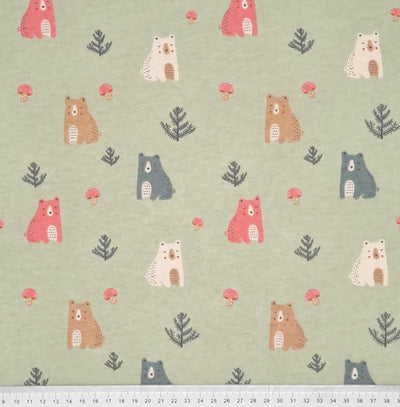 A cute forest bear design, printed on a soft brushed polycotton winceyette in light sage green with a cm ruler at the bottom