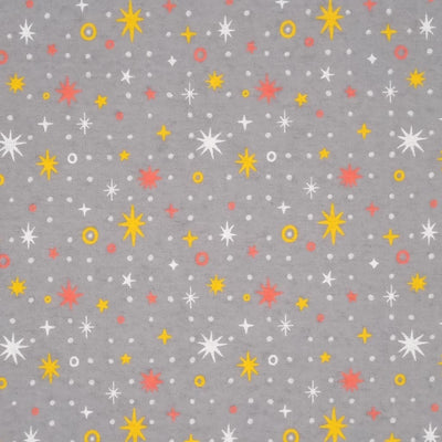 Sparkle stars in yellow and white printed on a grey, soft brushed polycotton winceyette.